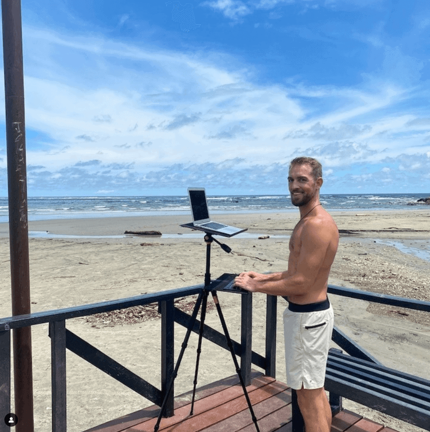 Working at a beach with the StandMore travel standing desk